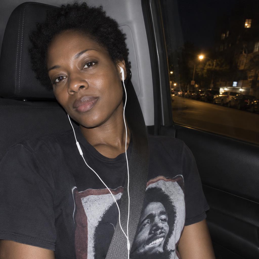 Car-Seat Point-and-Shoot: A close passenger-seat point-and-shoot portrait captured after dark.