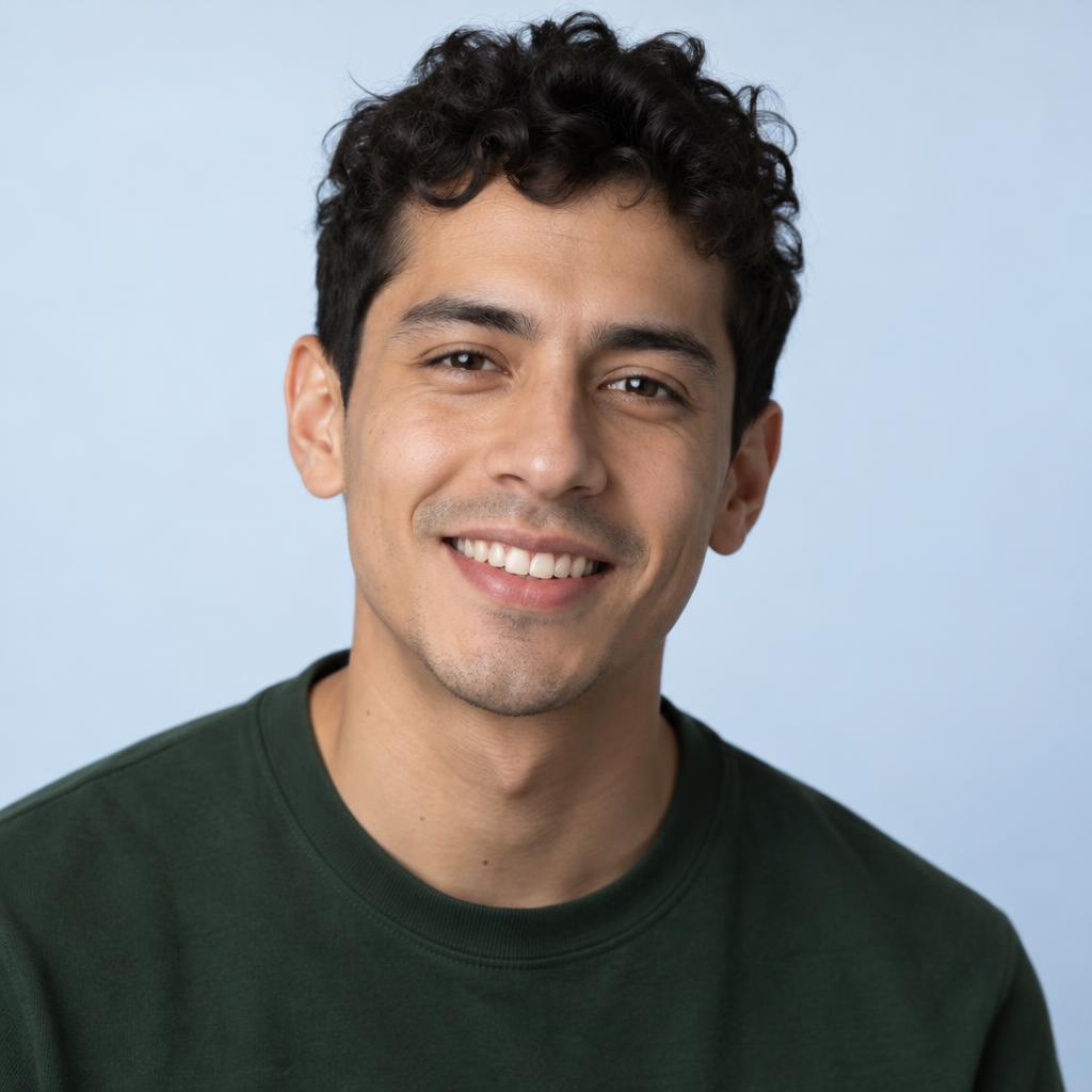 Bright Commercial Close-Up: Close commercial headshot framed from the upper chest, with the shoulders angled slightly and the face turned directly to the viewer.