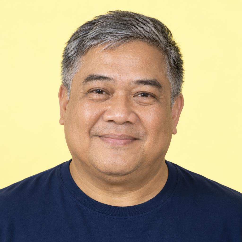 Bright Commercial Close-Up: Friendly commercial casting portrait cropped close at the shoulders.